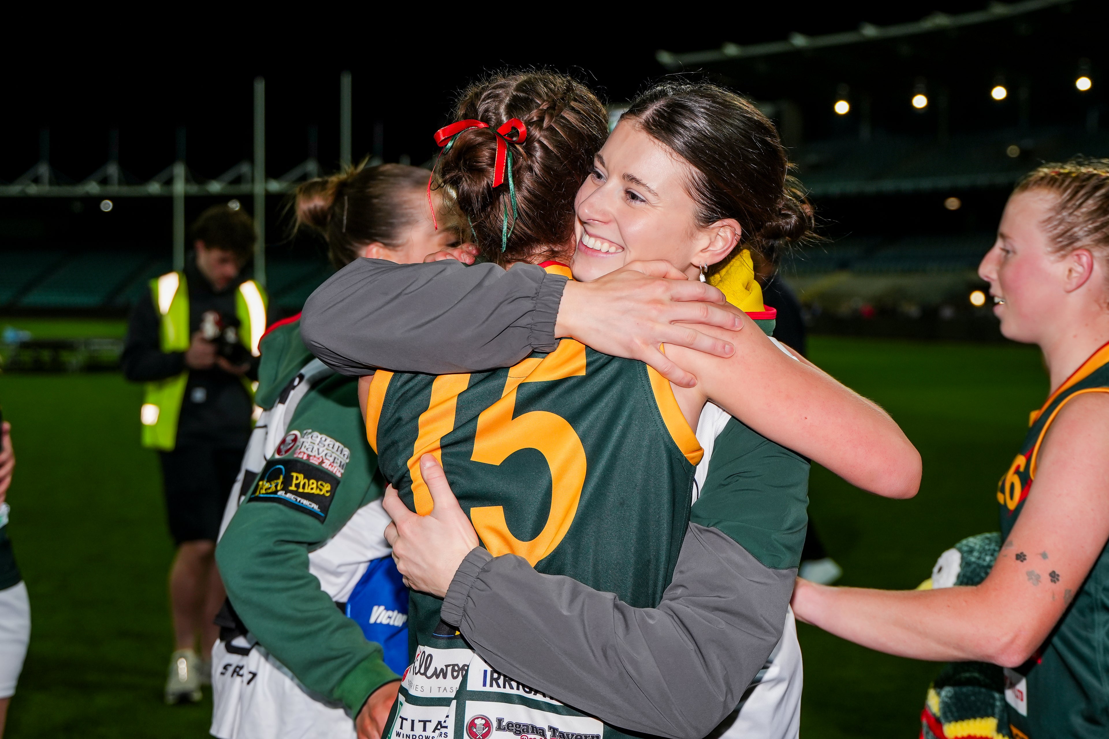 Two of our Bridgenorth Womens team hugging at UTAS stadium during the 2025 cup win