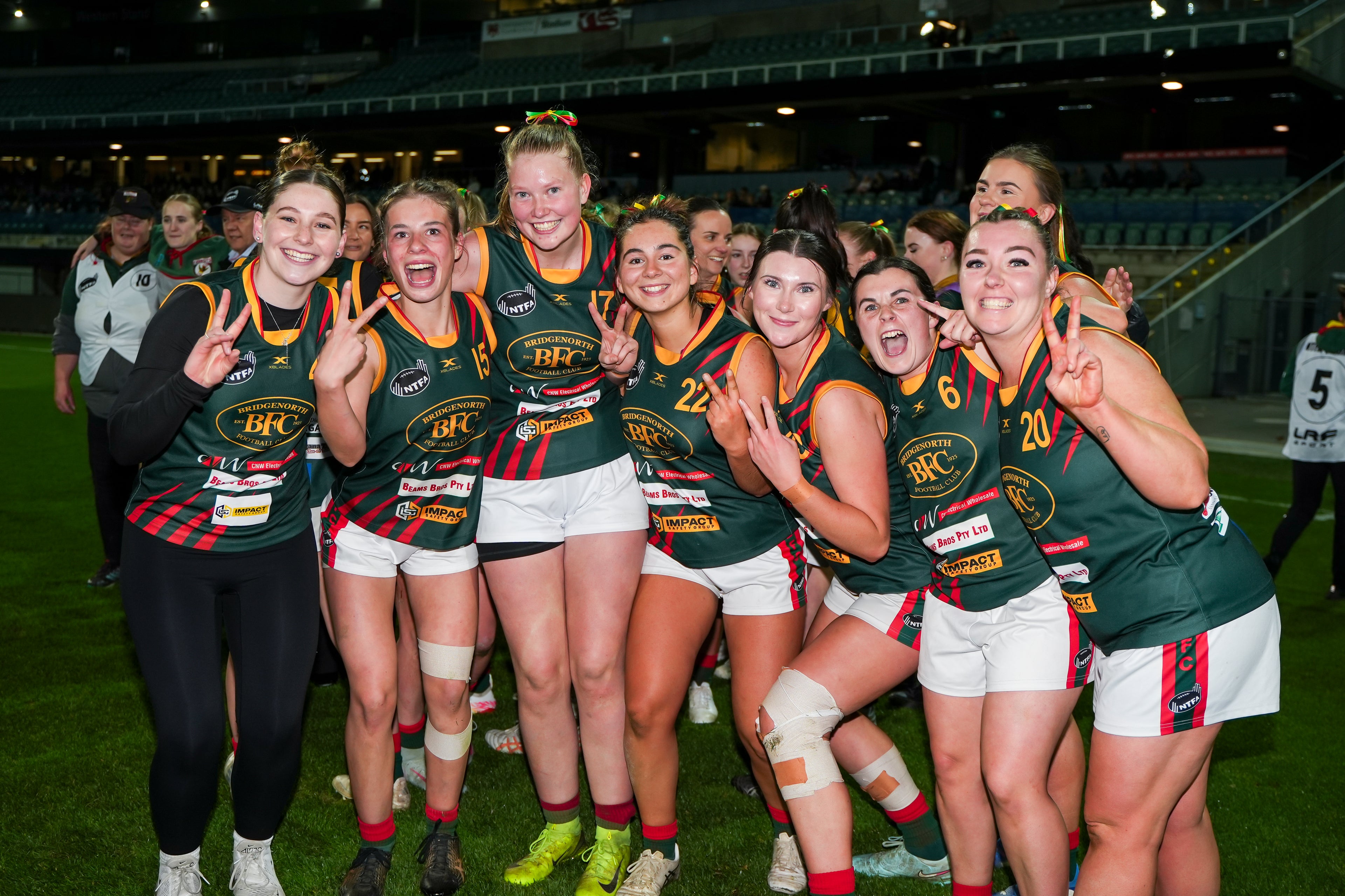 Women's team celebrating their grand final win in 2025