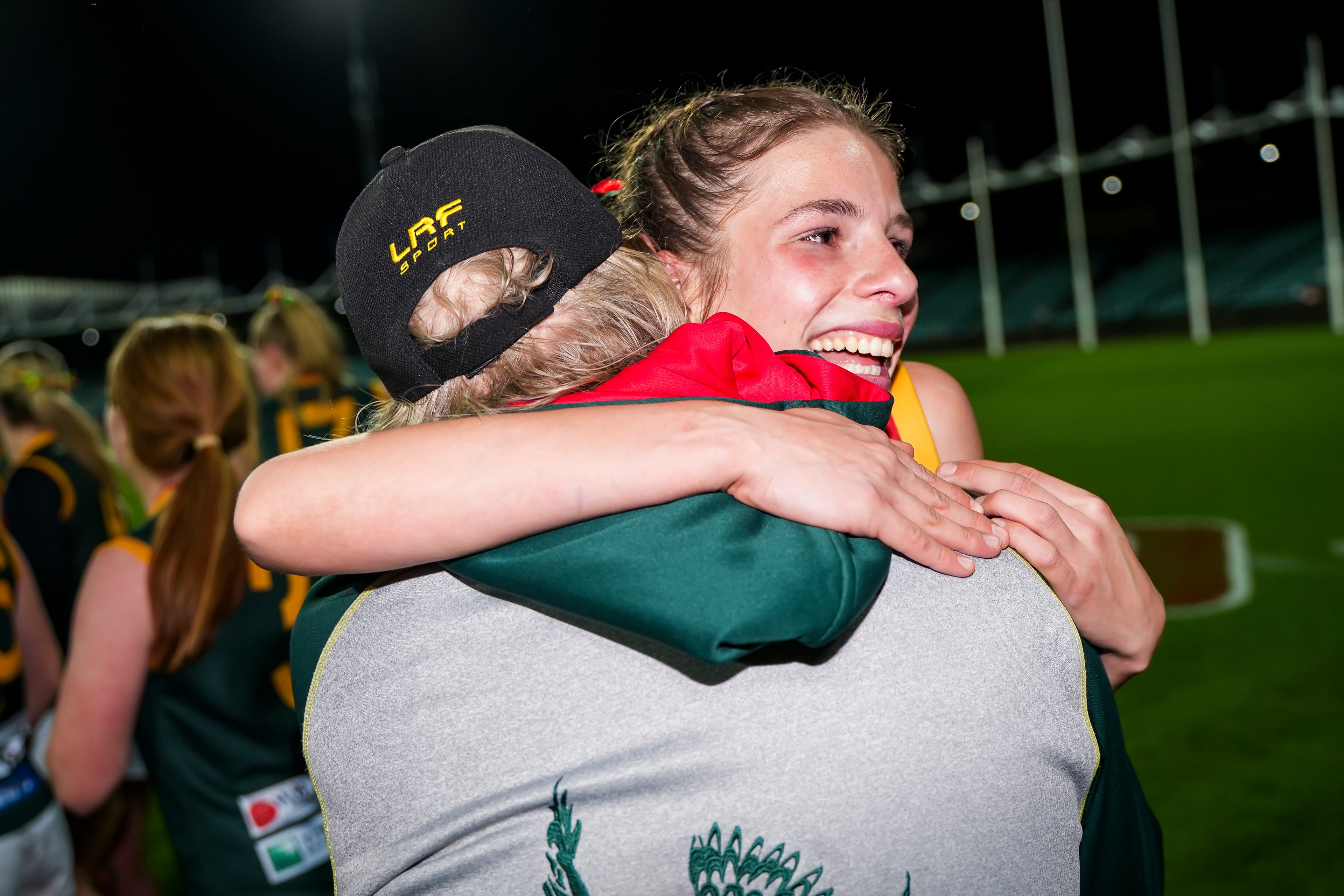 Taj and her dad celebrating the 2025 grand final win