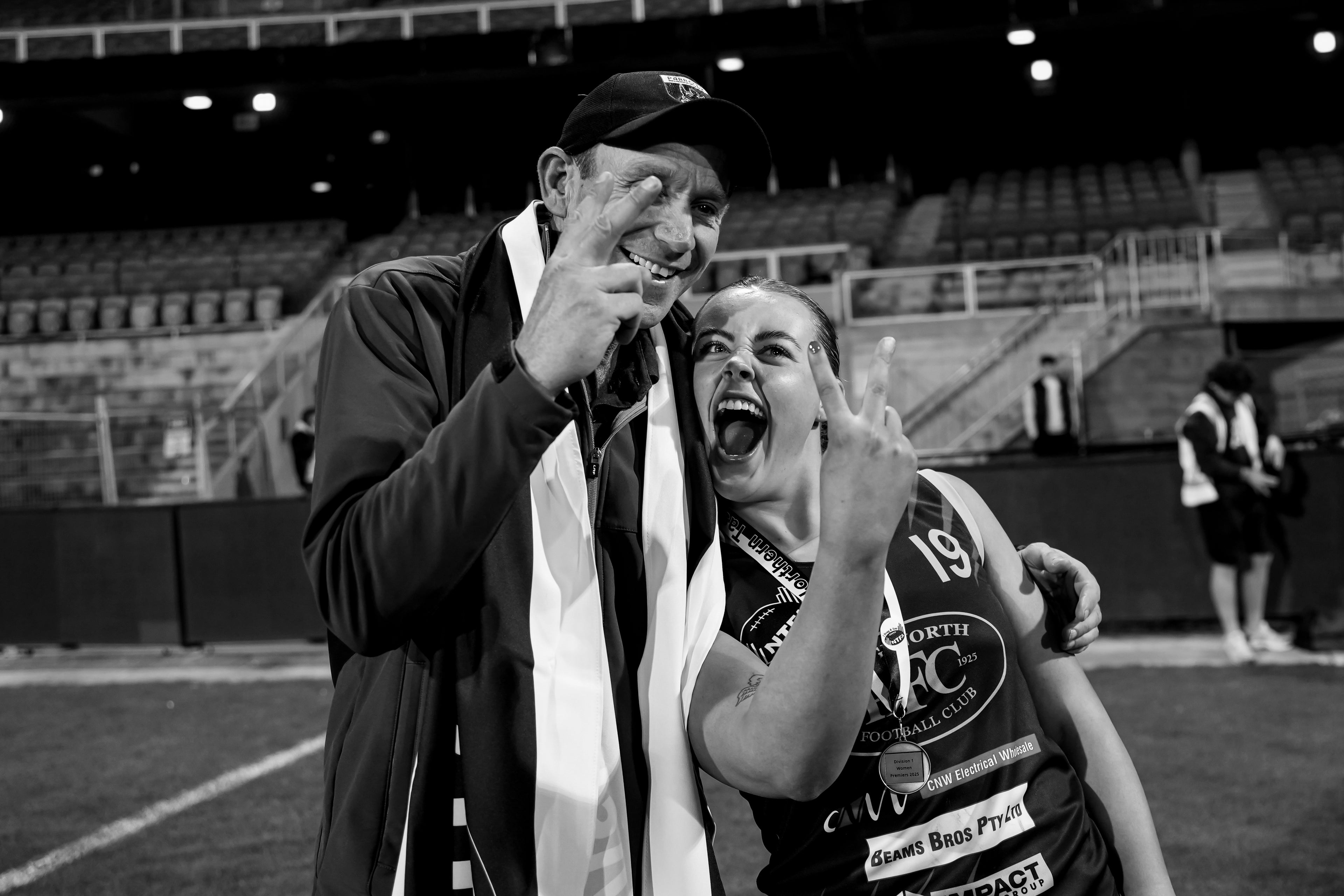 Emma and Bobby posing for a celebratory win photo