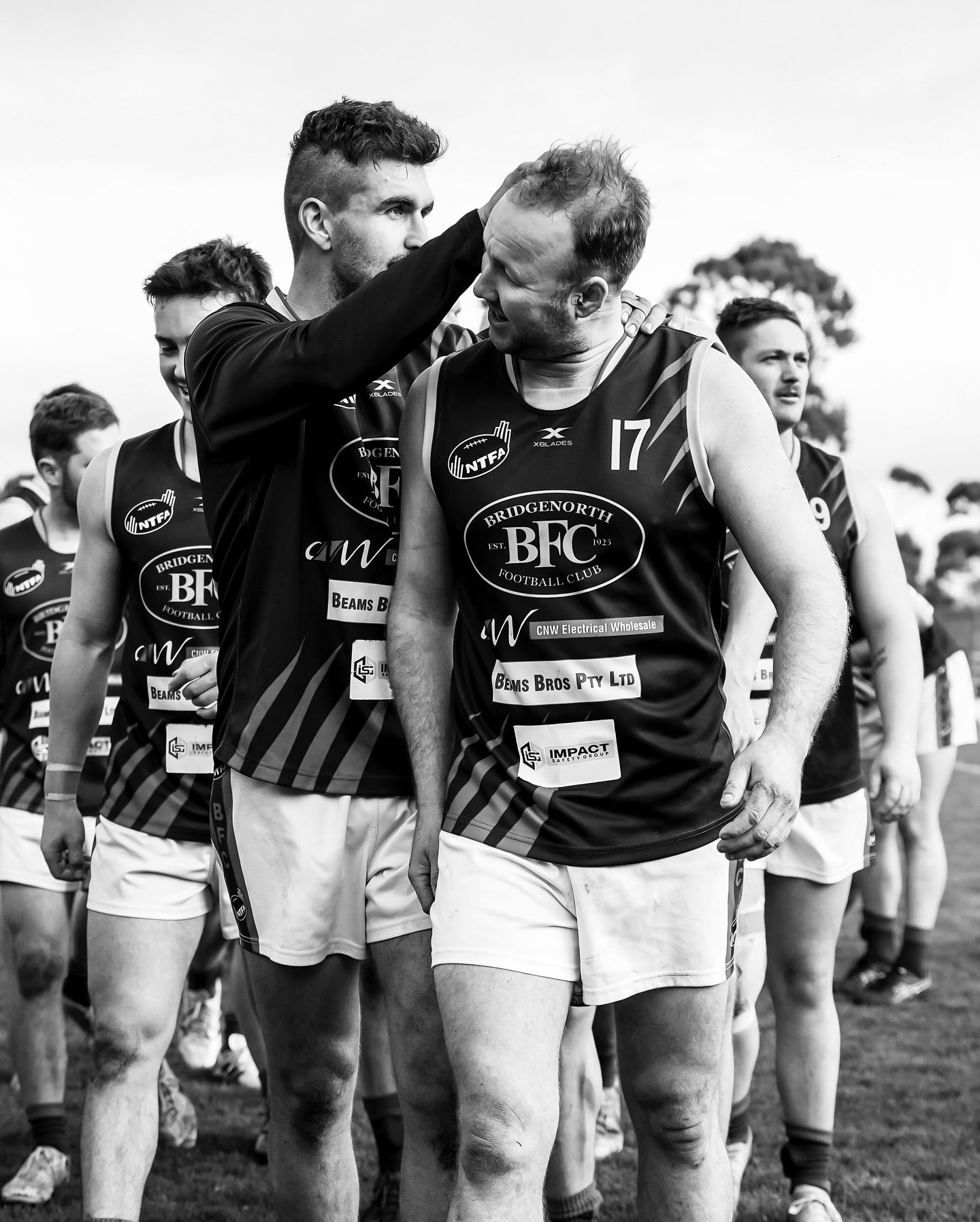 The reserves team celebrating in black and white
