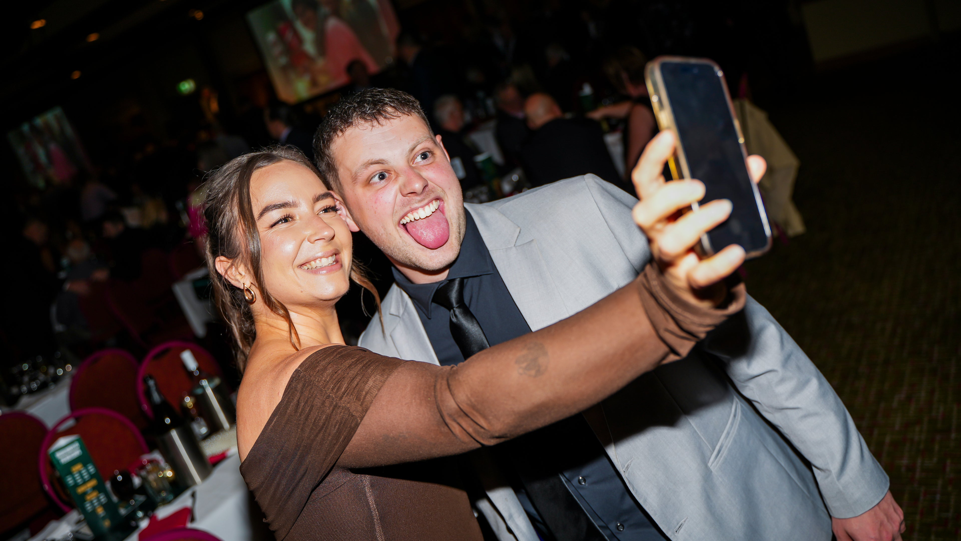 Grace and Aaron taking a selfie at the team of the century celebrations