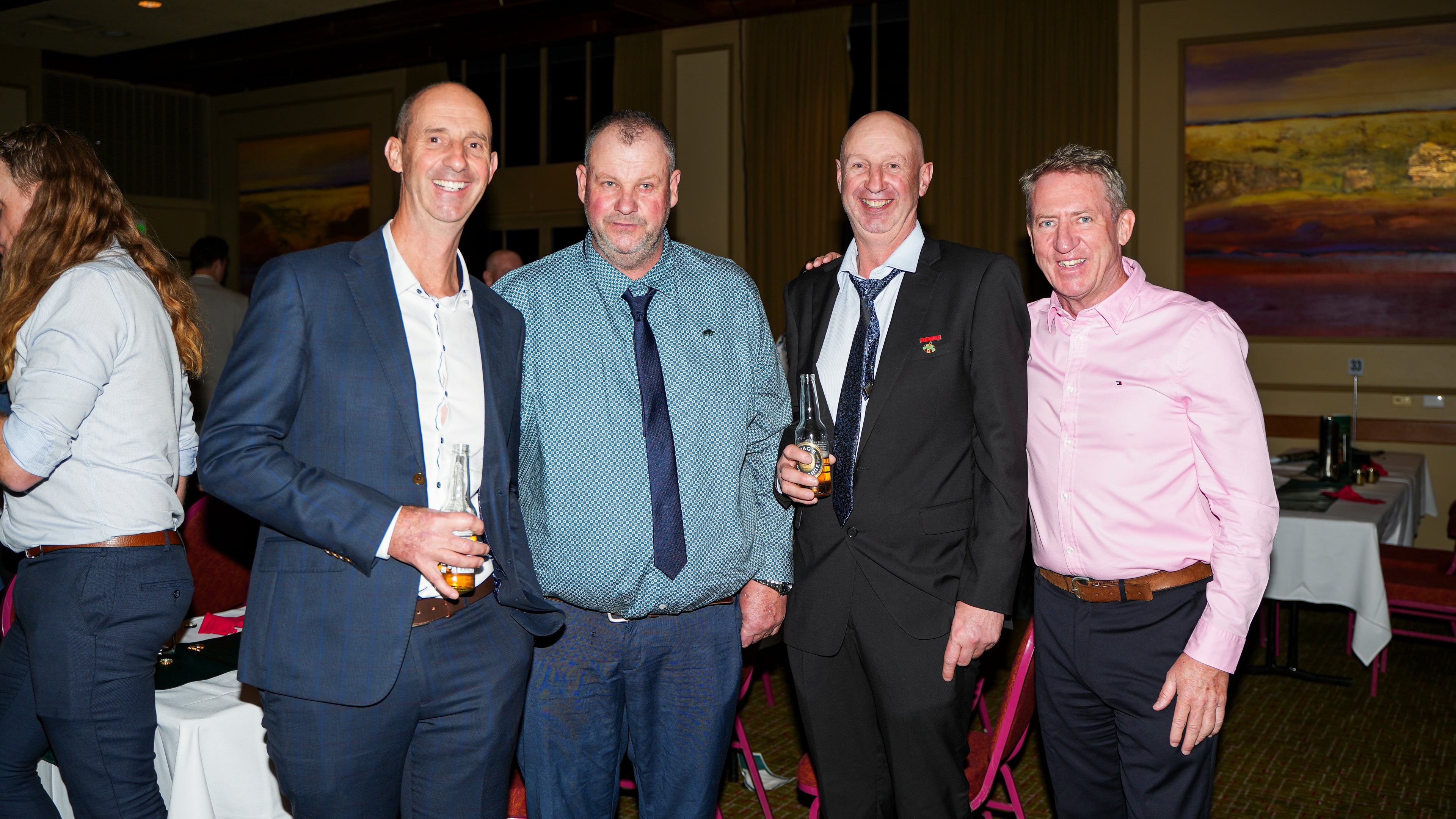 Four men posing at the 100 year celebrations of BFC