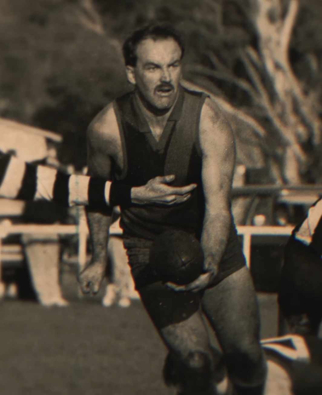 Vintage-style photograph of a man playing football