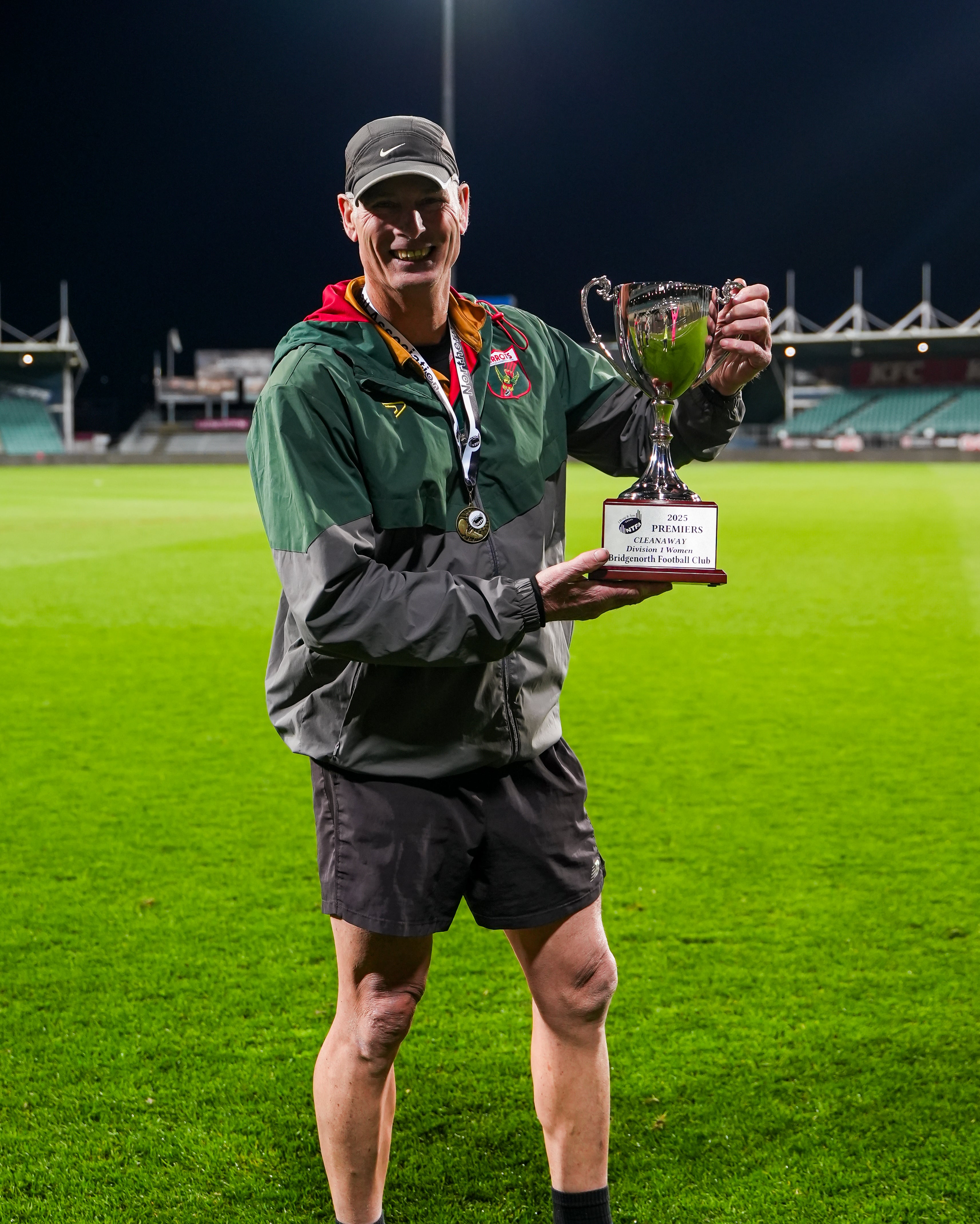 Robbo holding the 2025 Grand Final Trophy