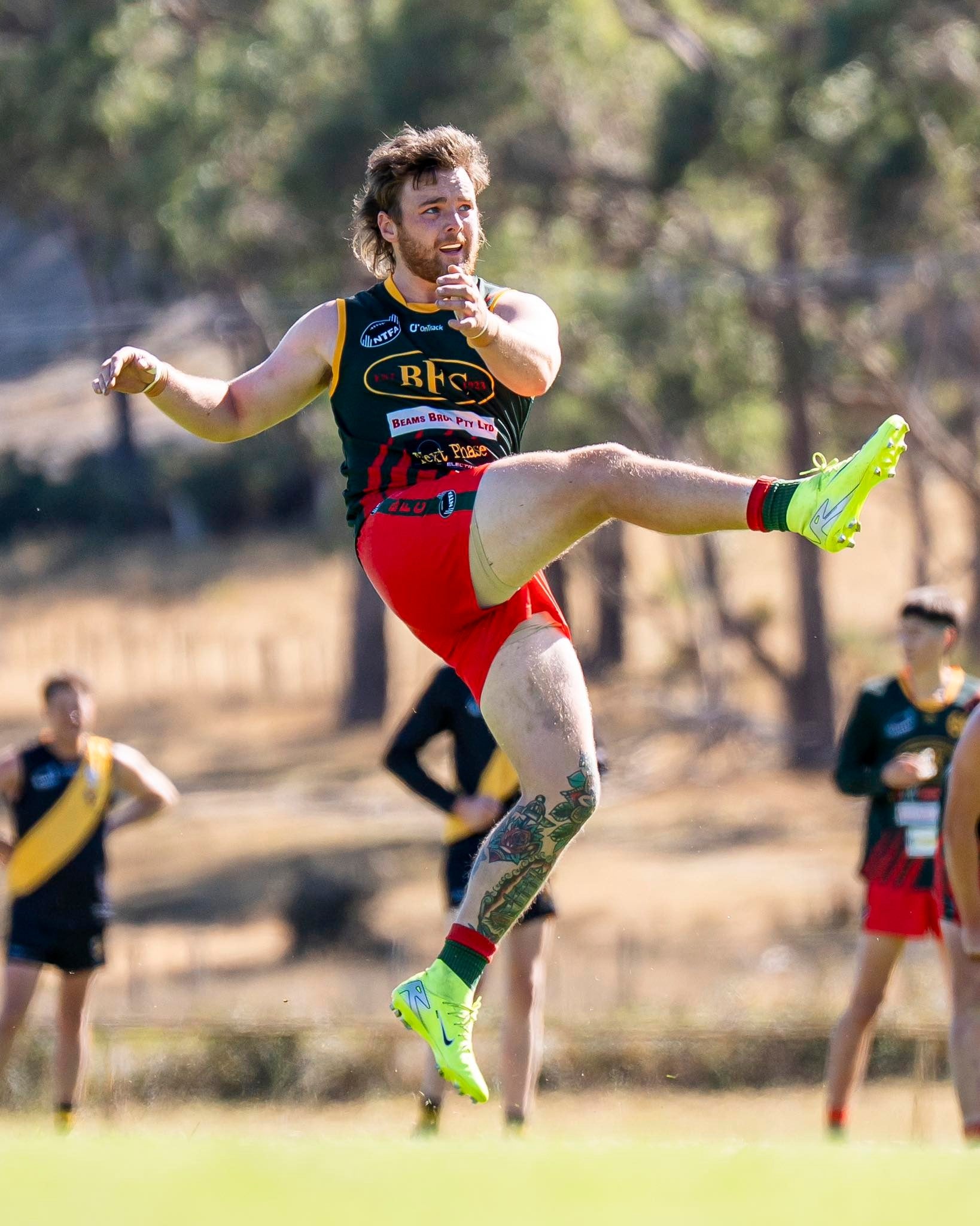 Billy Jack kicking the football