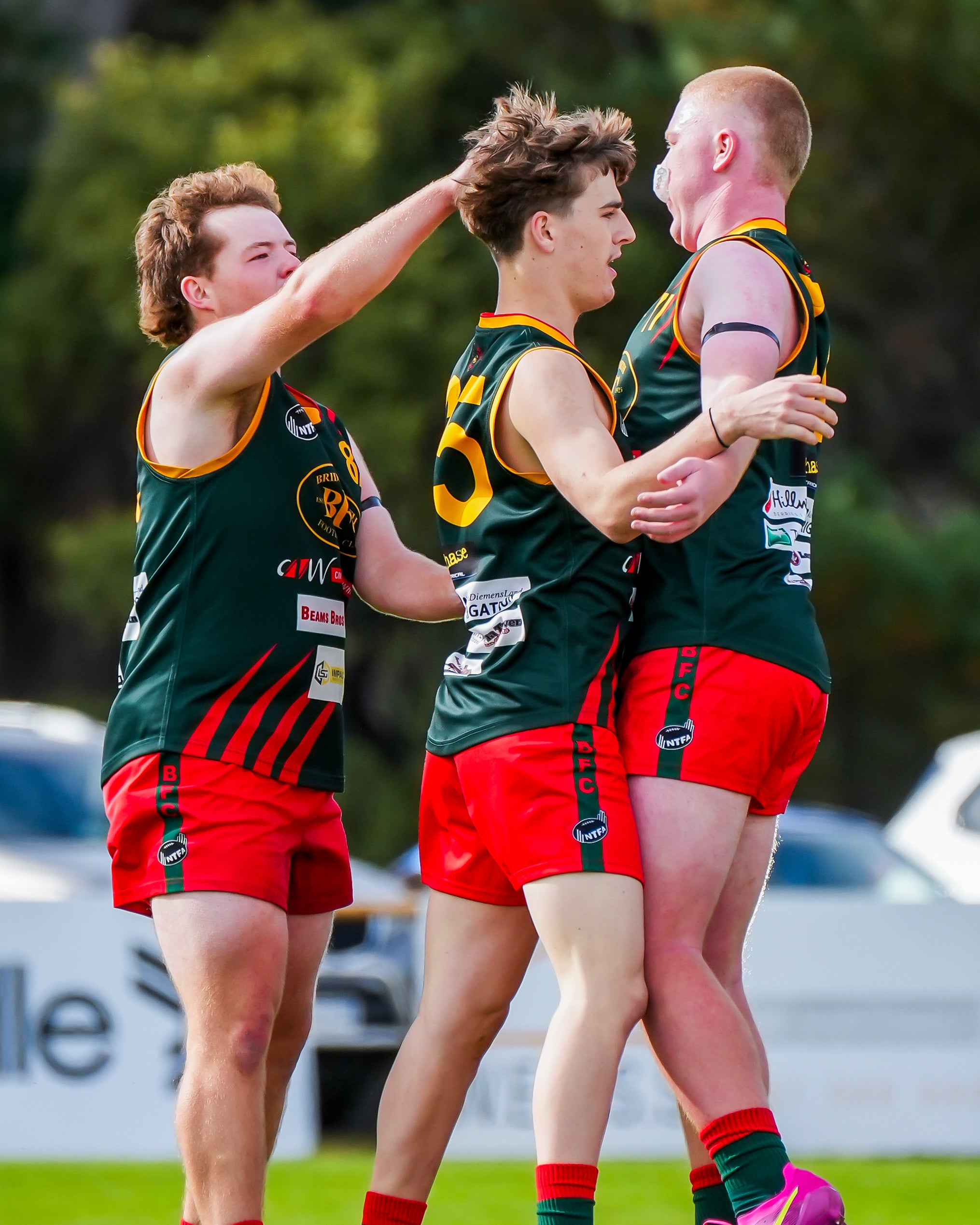 Under 18.5s players celebrating a goal