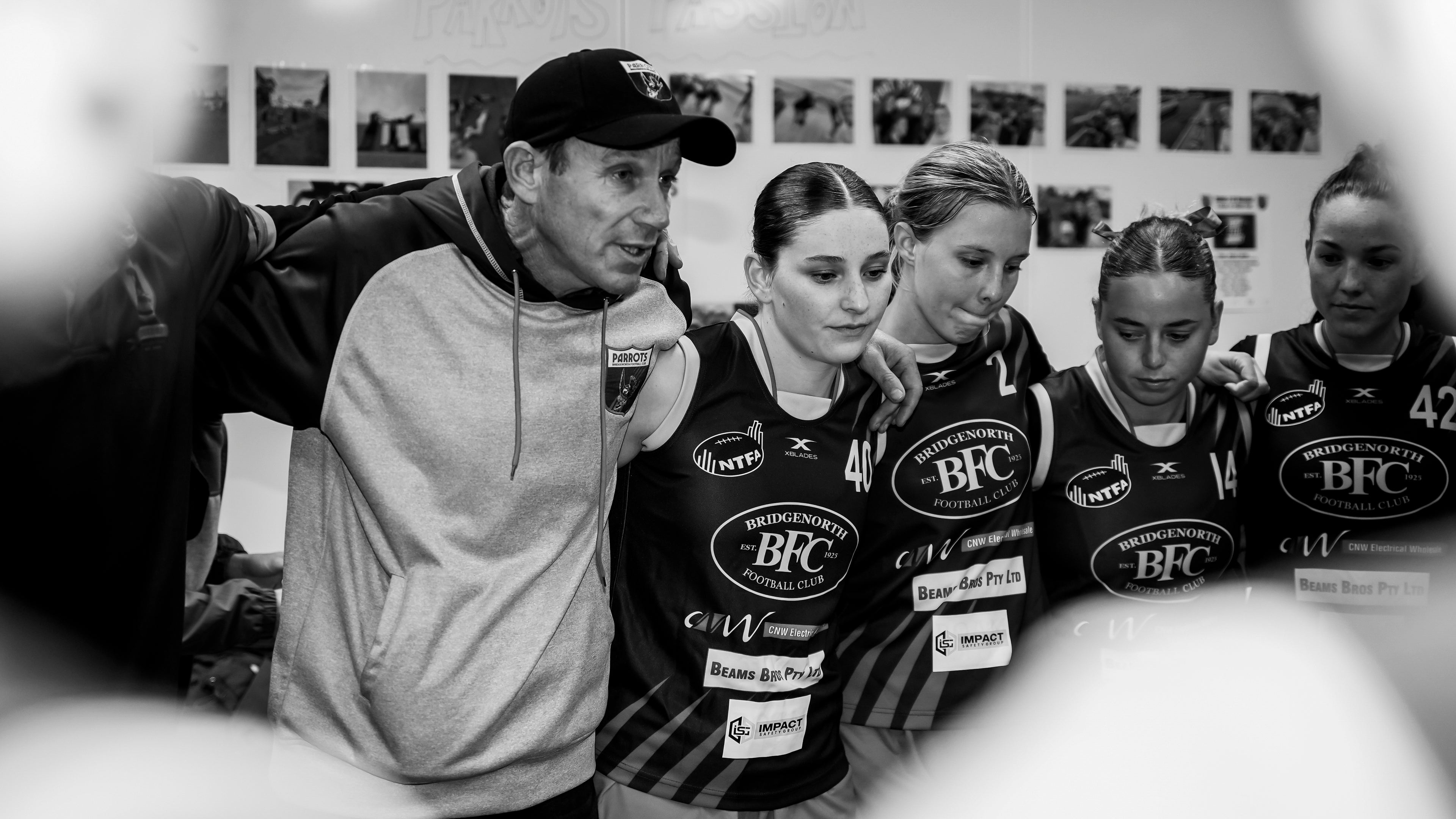 Bobby gathering the womens team into a huddle for game day