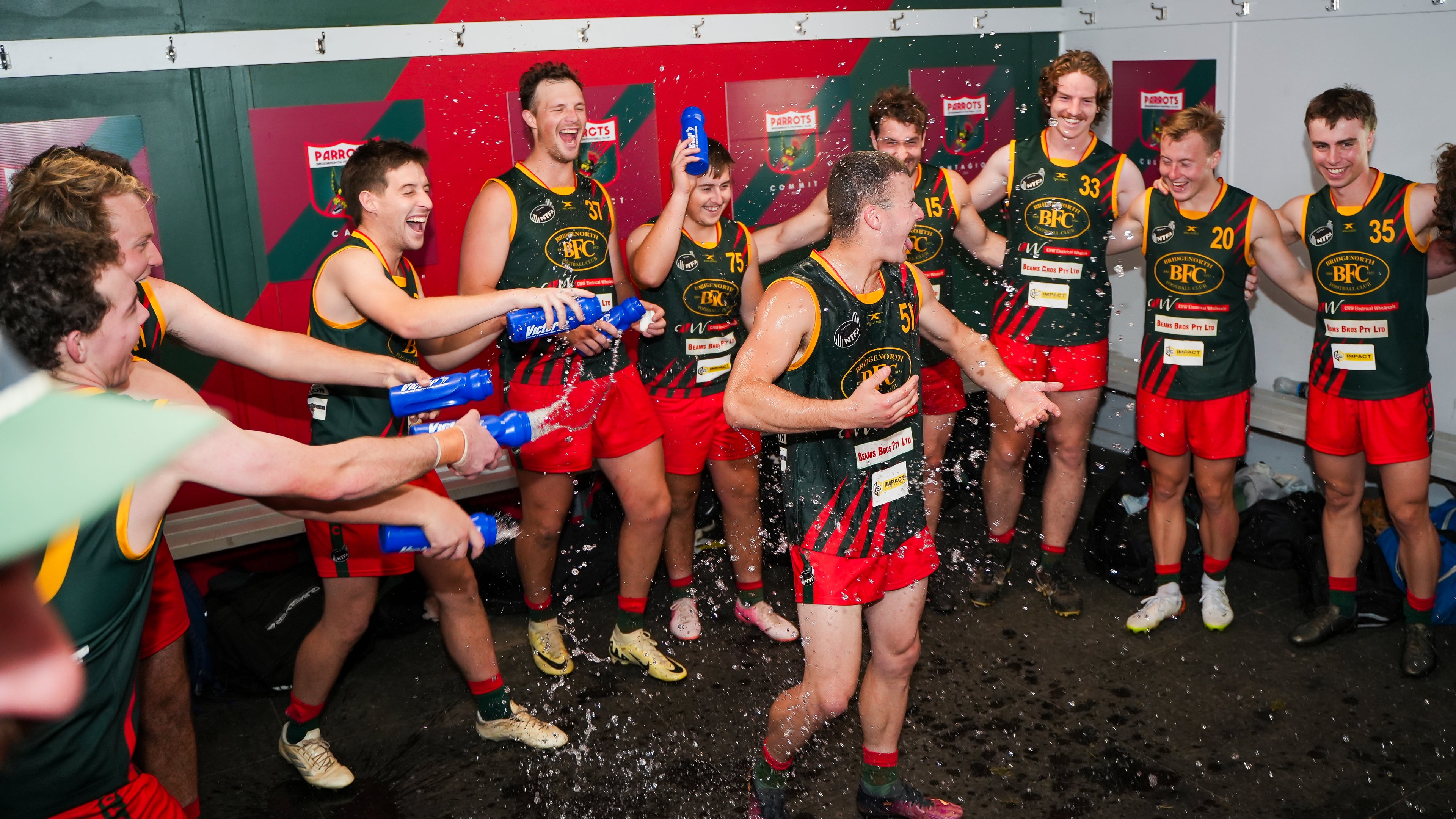 Reserves players celebrating in the locker room at Bridgenorth Football Club