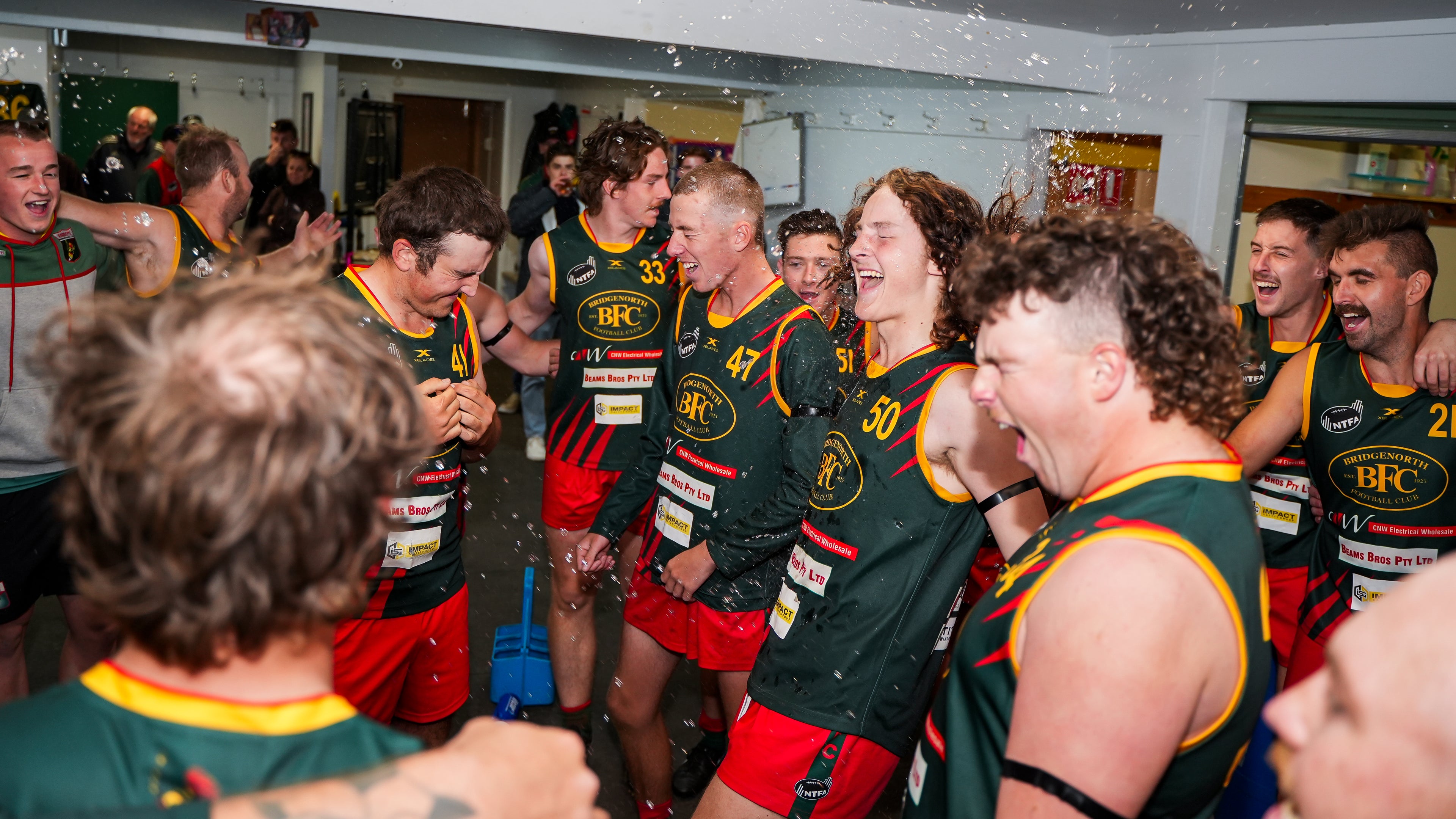 Reserves players celebrating in the locker rooms 